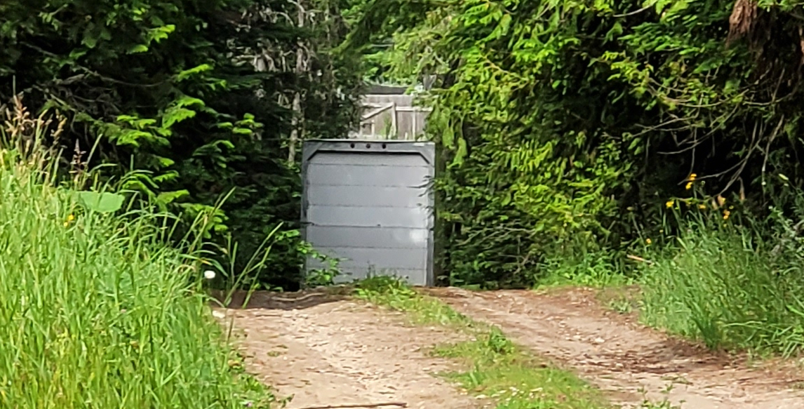 Down the Driveway: Commercial Trailer Departs for Good